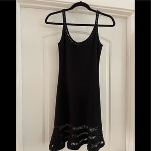 Black mini dress with cut outs.
